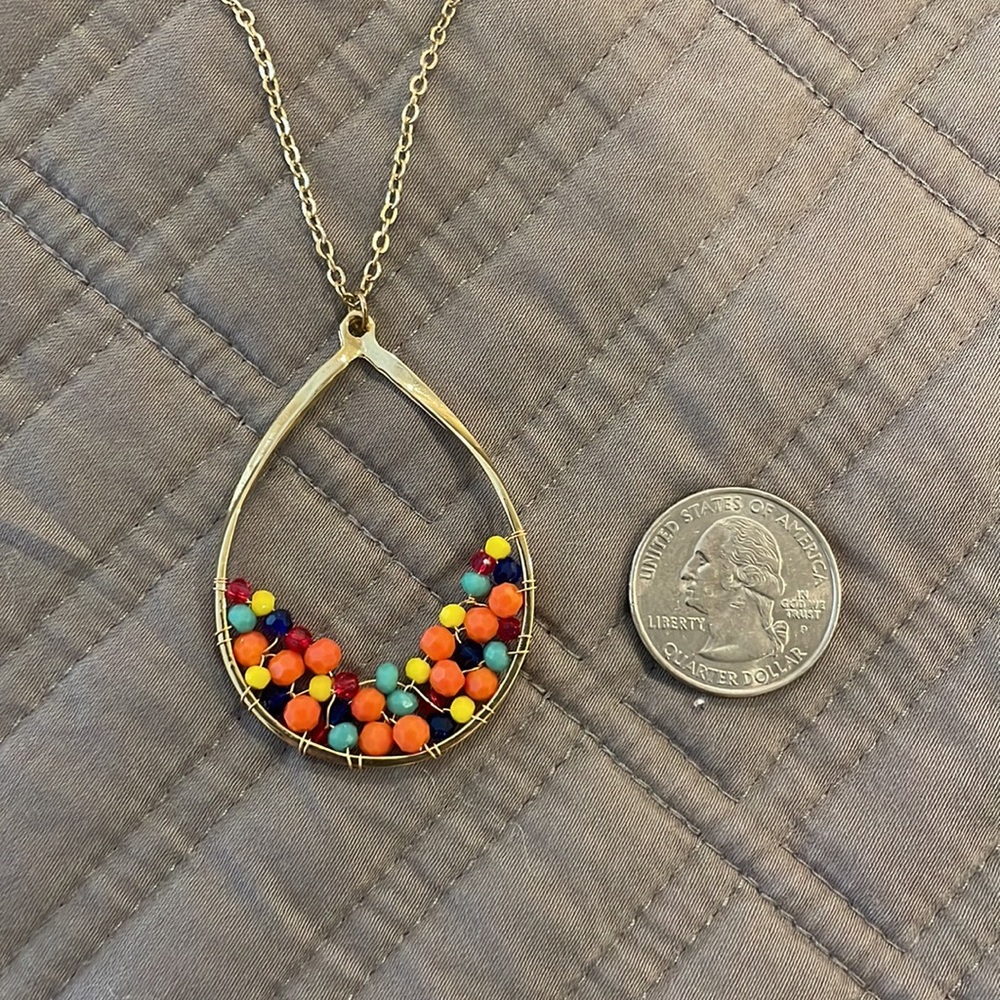 Beaded necklace. Gold, coral, green and yellow.